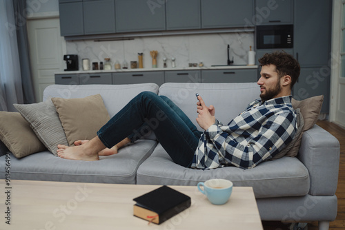 High angle view of an young brunette working at her office desk with documents and laptop.