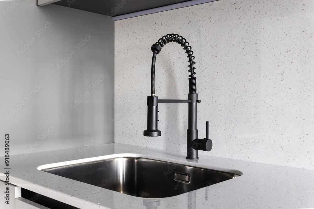 kitchen faucet on a stylish metal sink kitchen faucet on a stylish metal sink