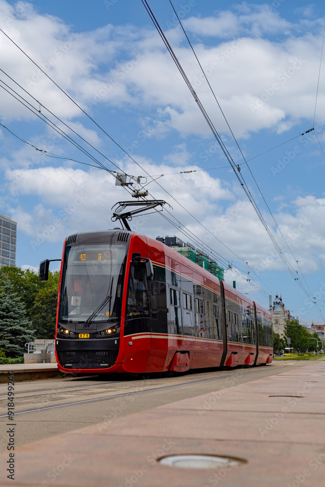 Naklejka premium Nowoczesny tramwaj elektryczny na ulicach miasta. Katowice. Polska Modern electric tram on the city streets. Katowice. Poland