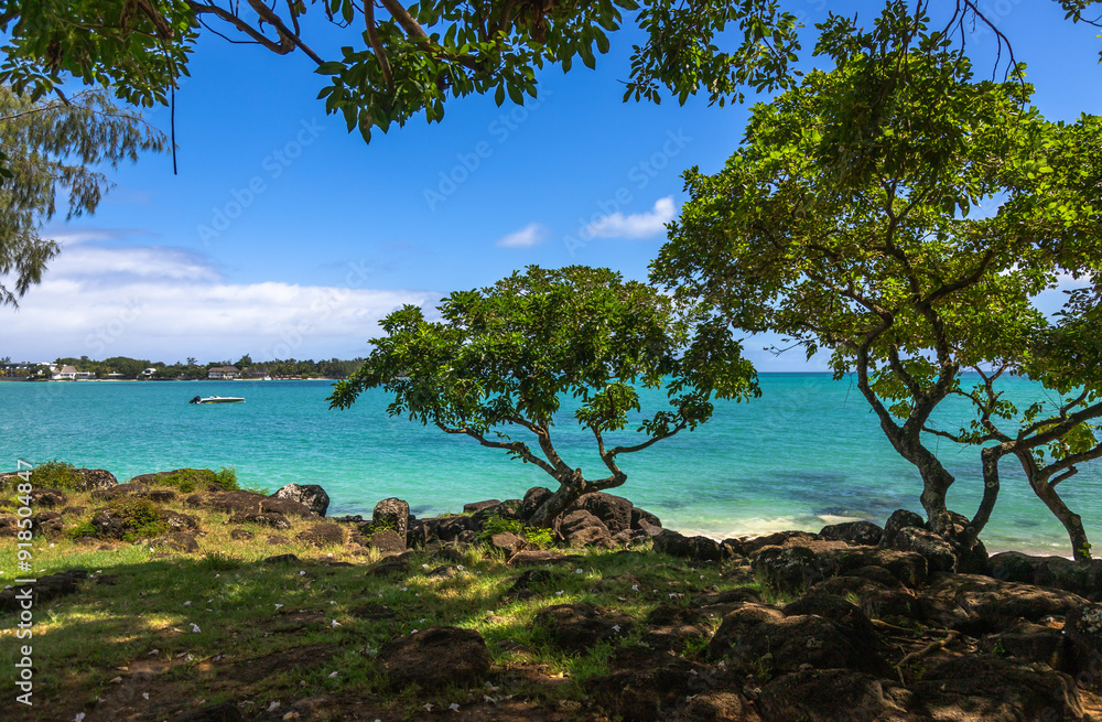Exposure of the amazing la Cuvette Beach, located in the center of the busy town of Grand Bay, with crystal clear water and beautiful shades of blue perfect for who is looking for a relaxing vacation Exposure of the amazing la Cuvette Beach, located in the center of the busy town of Grand Bay, with crystal clear water and beautiful shades of blue perfect for who is looking for a relaxing vacation