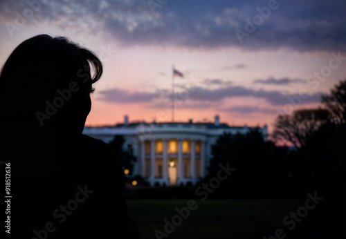 Democrat female politician standing in front of the White House. Back view of presidential candidate standing in front of the White House photo