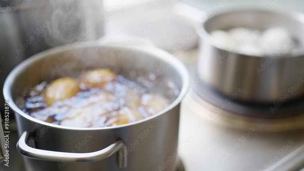 Boiling Potatoes in a Stainless Steel Pot for a Comforting and Wholesome Meal Preparation Boiling Potatoes in a Stainless Steel Pot for a Comforting and Wholesome Meal Preparation