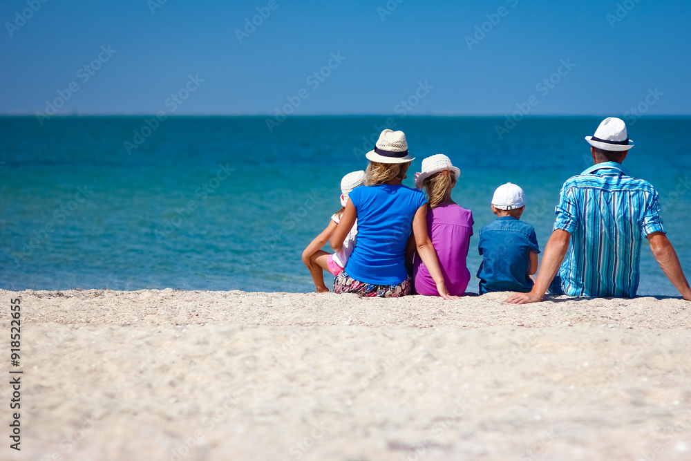 A Happy family parents with children by the sea on nature travel A Happy family parents with children by the sea on nature travel