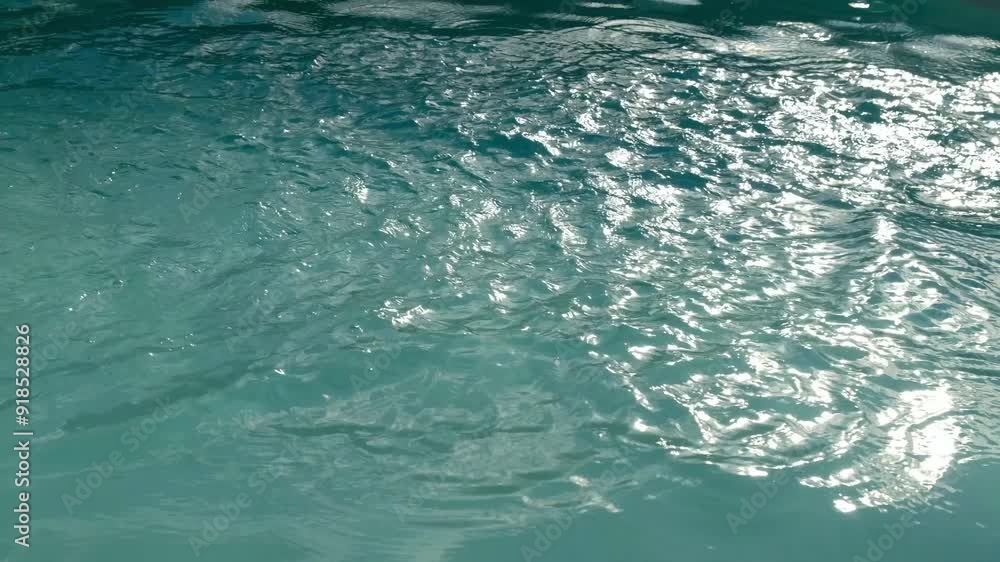 Blue reflections on the water. Oscillation on the water surface. Blue water background. Blue reflections on the water. Oscillation on the water surface. Blue water background.