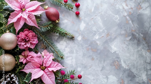 Pink poinsettia with pine branches, ornaments, and red berries on a gray background with gold flecks.