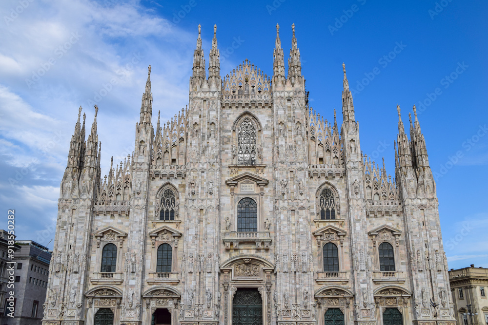 Milan, Italy. AUG 3,2024.
Famous Cathedral Duomo di Milano with Gothic spires and marble statues. Milan, Italy. AUG 3,2024.
Famous Cathedral Duomo di Milano with Gothic spires and marble statues.