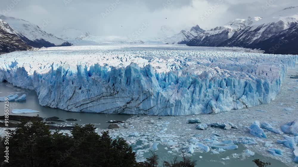 Perito Moreno Glacier At El Calafate Santa Cruz Argentina. Stunning View Of Icebergs Breaking Off Into The Water . Outdoor Travel Destination Patagonia Glacier. Outdoor Patagonia Above View. Perito Moreno Glacier At El Calafate Santa Cruz Argentina. Stunning View Of Icebergs Breaking Off Into The Water . Outdoor Travel Destination Patagonia Glacier. Outdoor Patagonia Above View.