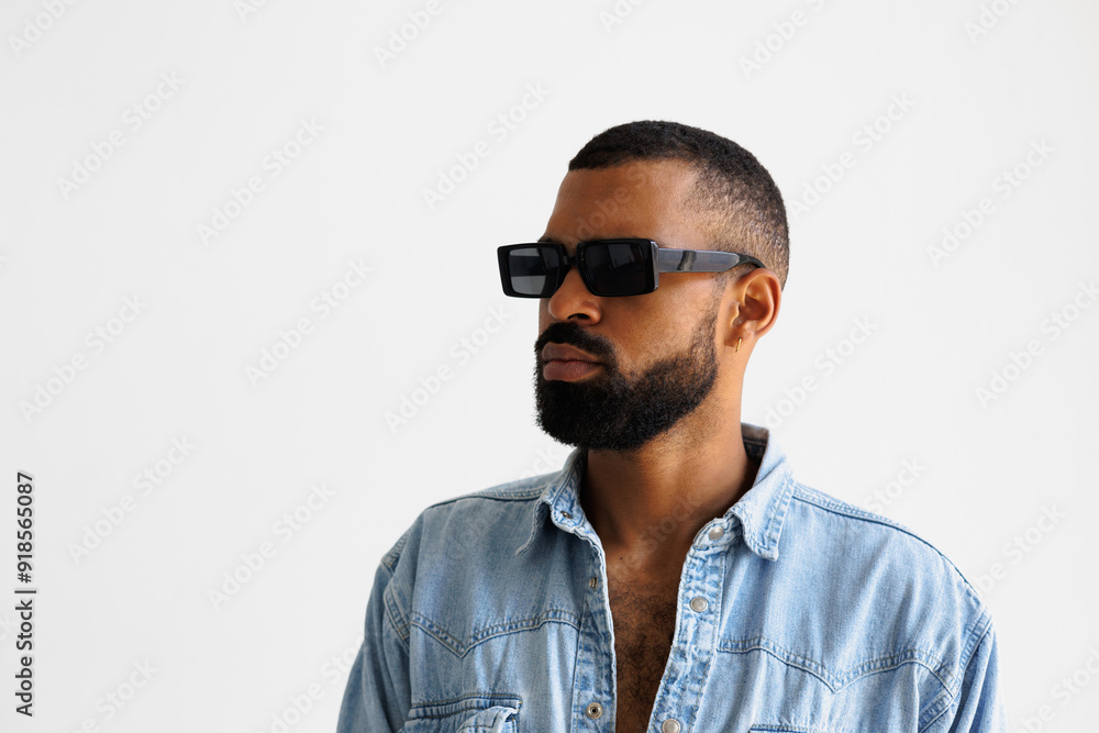 Bearded african american man in sunglasses and denim shirt isolated on grey Bearded african american man in sunglasses and denim shirt isolated on grey