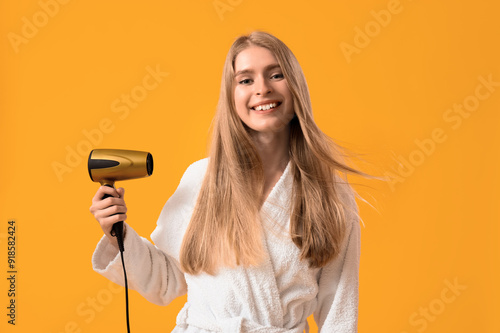 Young blonde woman with hai...