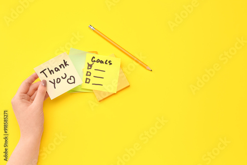 Woman with sticky notes and...