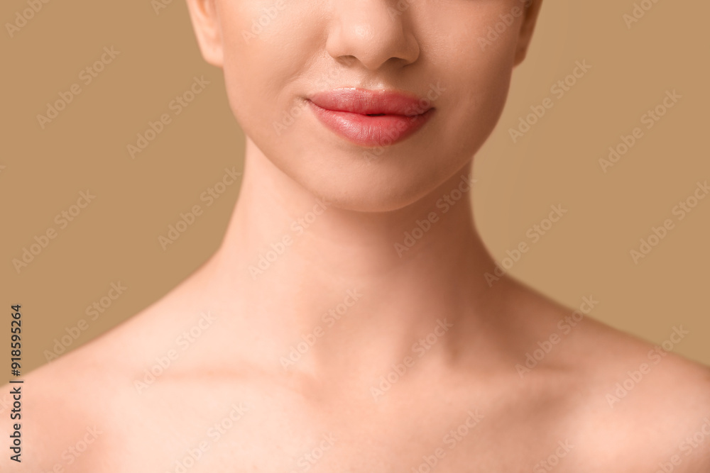 Young woman with beautiful lips on brown background, closeup Young woman with beautiful lips on brown background, closeup