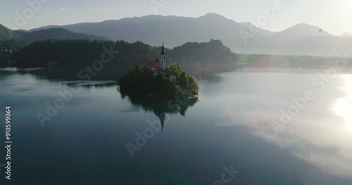 Aerial view, panoramic Bled Lake, beauty heritage in Slovenia. Island with church and castle in the background create a dream setting. View from Ojstrica and Mala Osojnica with the heart-shaped bench.