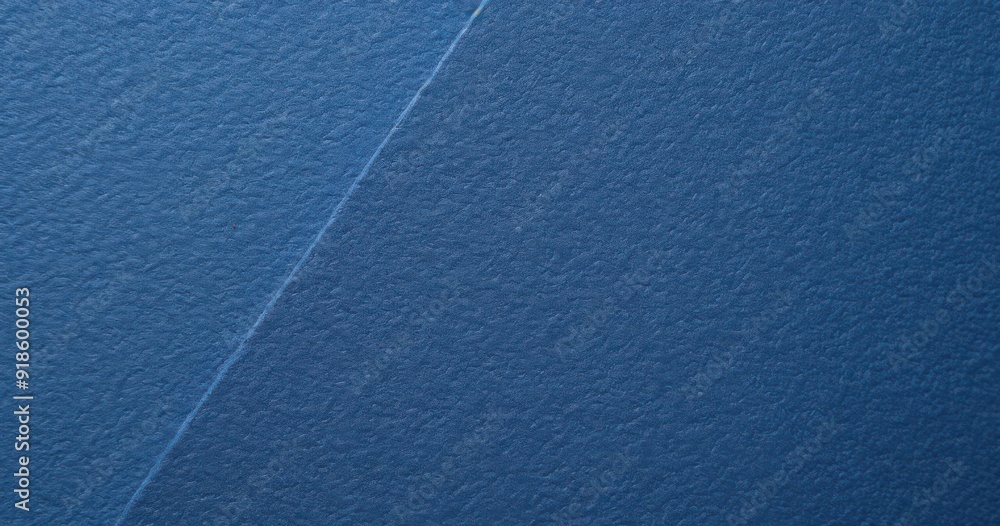 Fototapeta premium Close-up of textured blue construction paper backdrop