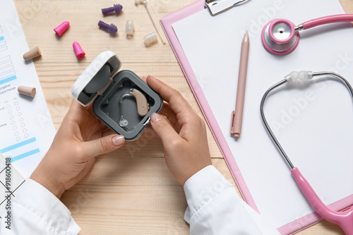 Hands of female doctor with...