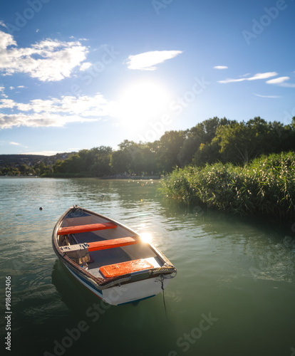 Red boat on lake Balaton in summer