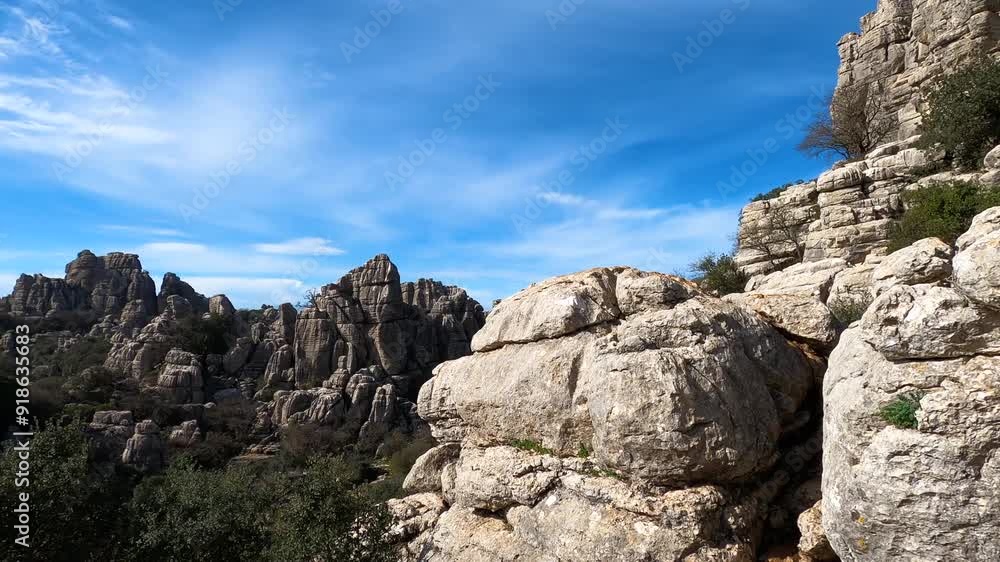 Hiking in the Torcal de Antequerra National Park, limestone rock formations and known for unusual karst landforms in Andalusia, Malaga, Spain. Hiking in the Torcal de Antequerra National Park, limestone rock formations and known for unusual karst landforms in Andalusia, Malaga, Spain.