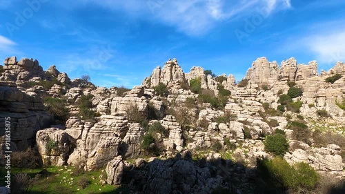 Hiking in the Torcal de Antequerra National Park, limestone rock formations and known for unusual karst landforms in Andalusia, Malaga, Spain.