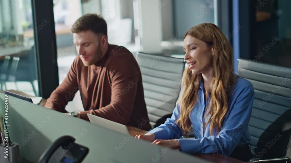 Professional managers talking workplace typing laptops in office closeup. Professional managers talking workplace typing laptops in office closeup.