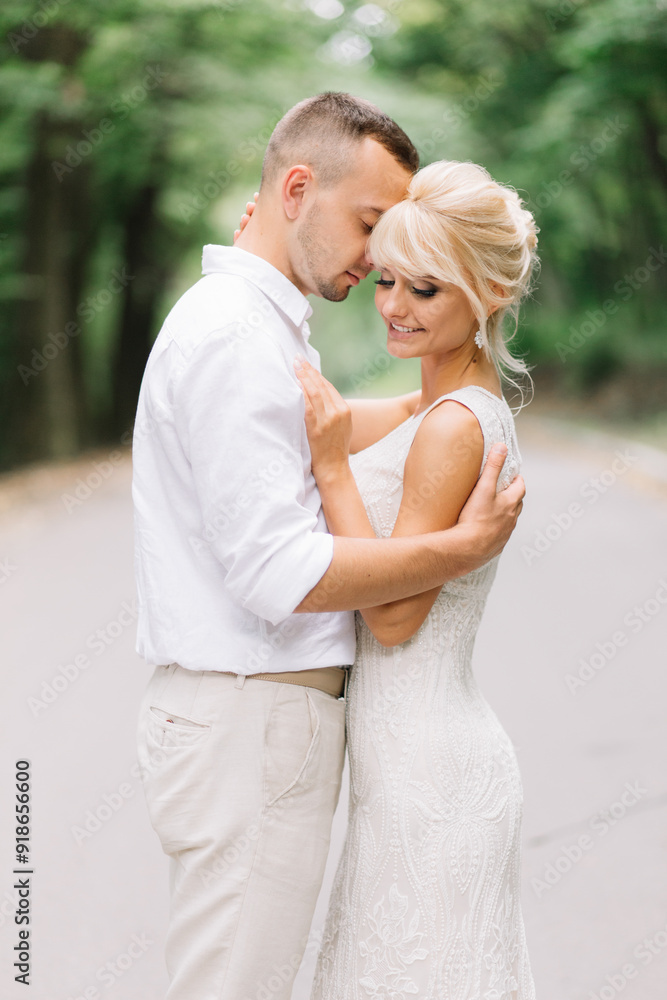 Romantic Couple Embracing In Nature, Smiling And Enjoying A Tender Moment Together Romantic Couple Embracing In Nature, Smiling And Enjoying A Tender Moment Together