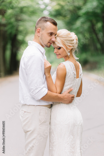 Romantic Couple Embracing In Nature, Smiling And Enjoying A Tender Moment Together