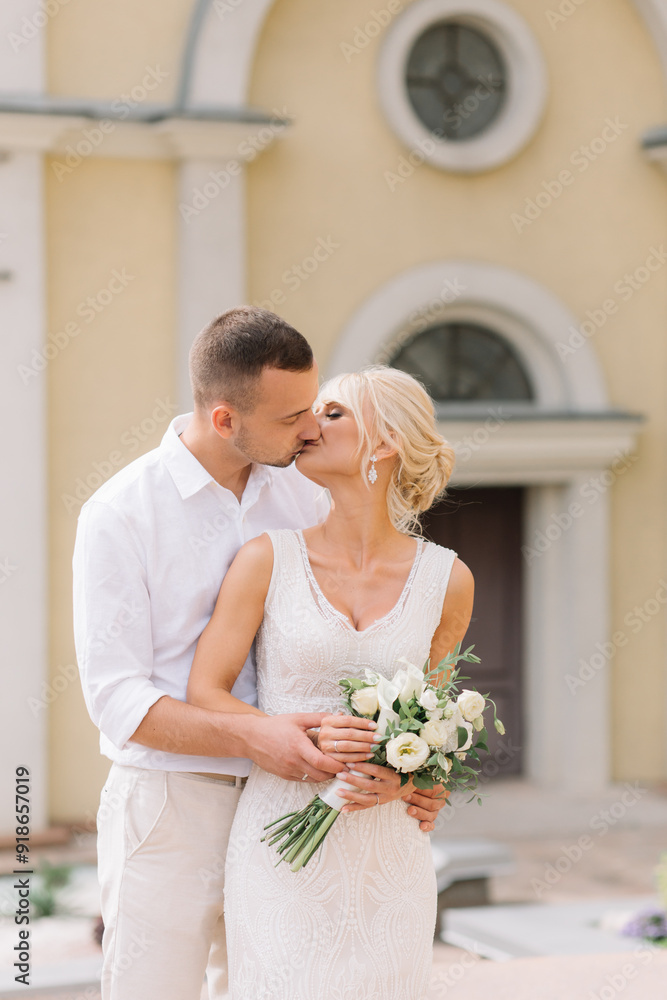 Happy Bride And Groom Posing Together On Their Wedding Day Outdoors Happy Bride And Groom Posing Together On Their Wedding Day Outdoors