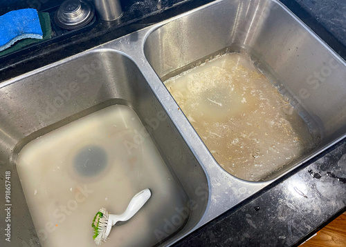 Wall Mural Stainless steel kitchen sink clogged and backed up