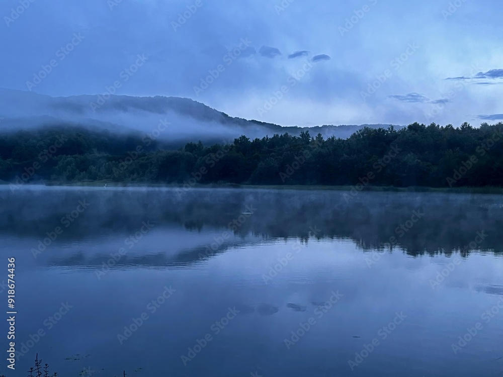fog over the lake in the morning fog over the lake in the morning