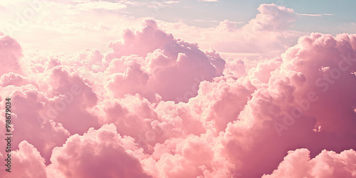 Fototapeta Naklejka Na Ścianę i Meble -  Dreamy Pink Clouds: A cloudy sky filled with cotton candy pink clouds