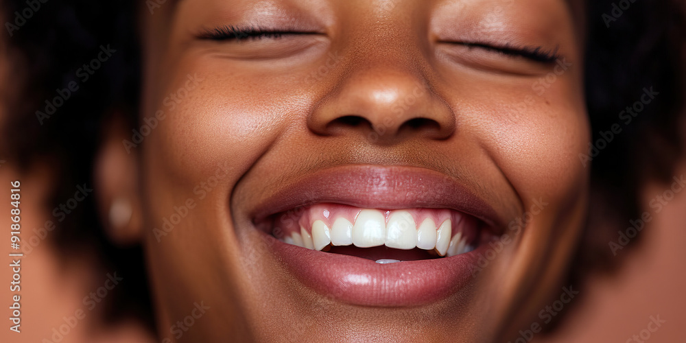 Eyes Wide Open: A person's face in mid-laugh, with their eyes closed and mouth open, showcasing their genuine emotion Eyes Wide Open: A person's face in mid-laugh, with their eyes closed and mouth open, showcasing their genuine emotion