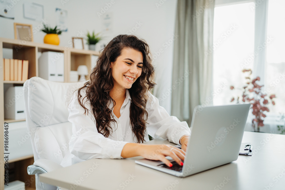Young caucasian business woman working in office on laptop Young caucasian business woman working in office on laptop
