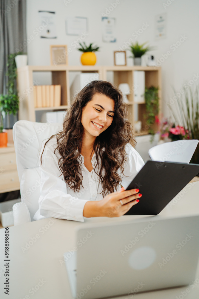 Young caucasian business woman working in office on laptop Young caucasian business woman working in office on laptop