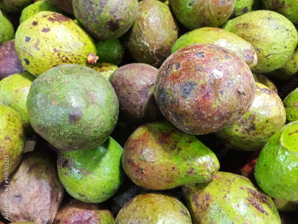 Fresh organic avocado at traditional market. Avocado is a fruit from the tropics that has a savory taste and is very suitable for consumption by people who are on a diet program