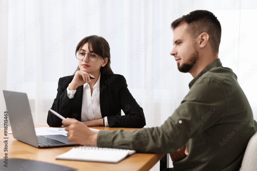 Consultant working with partner at table in office. Business meeting Consultant working with partner at table in office. Business meeting