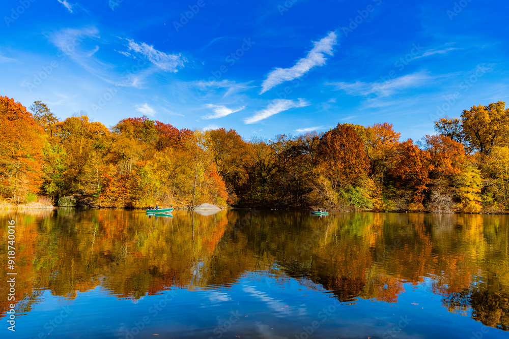 Seasonal fall landscape. Park boat in autumn pond, New York. Scenic fall. Central park in autumn. Autumn landscape. Boat in pond. Fall nature landscape. Autumn nature in Central park. Nature views Seasonal fall landscape. Park boat in autumn pond, New York. Scenic fall. Central park in autumn. Autumn landscape. Boat in pond. Fall nature landscape. Autumn nature in Central park. Nature views