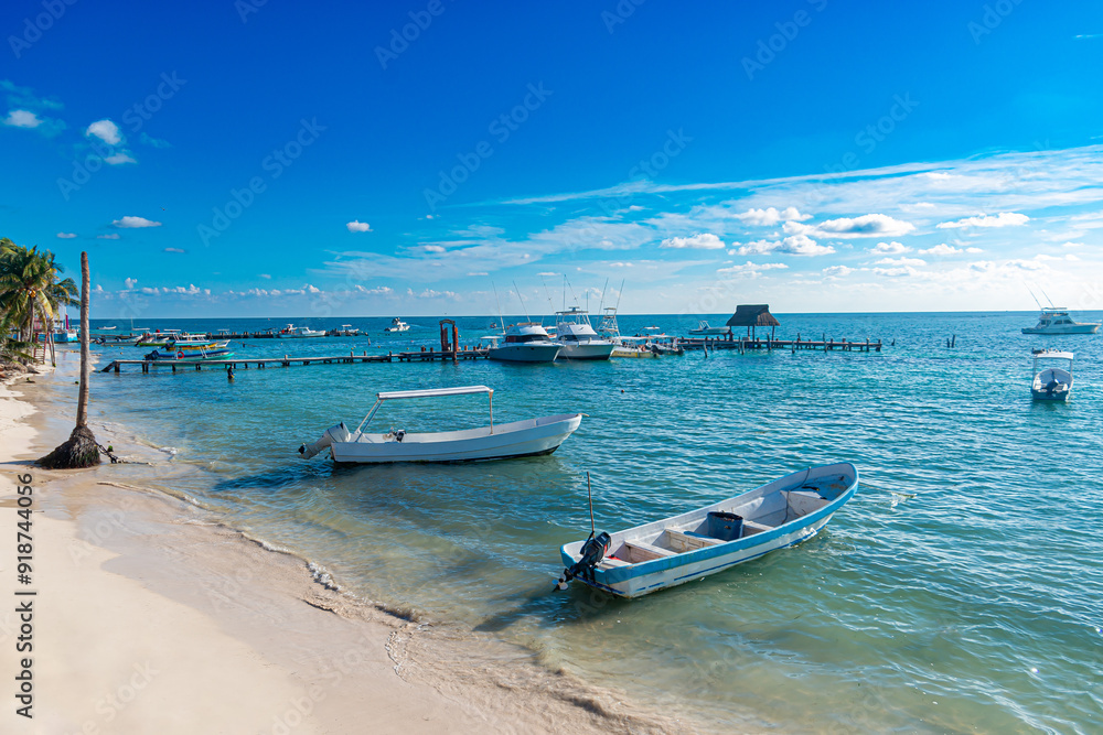 Sunny Day in Puerto Morelos: White Boats and Turquoise Caribbean Waters Sunny Day in Puerto Morelos: White Boats and Turquoise Caribbean Waters