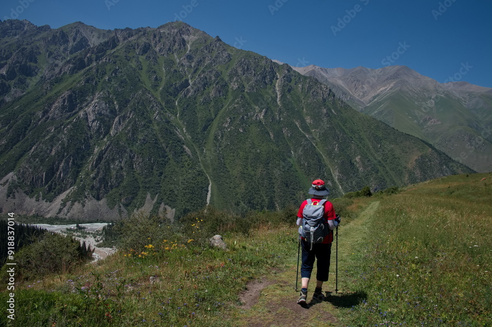 Senior woman hiking in Ala Archa National Park in Kyrgyzstan Senior woman hiking in Ala Archa National Park in Kyrgyzstan