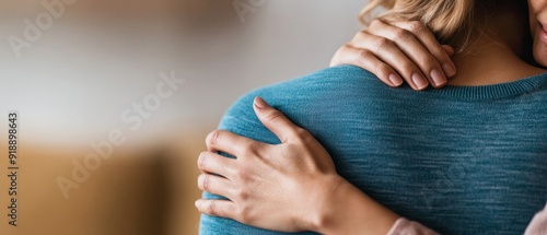 woman receiving comforting touch on shoulder, empathy, support, compassionate gesture, close up photo