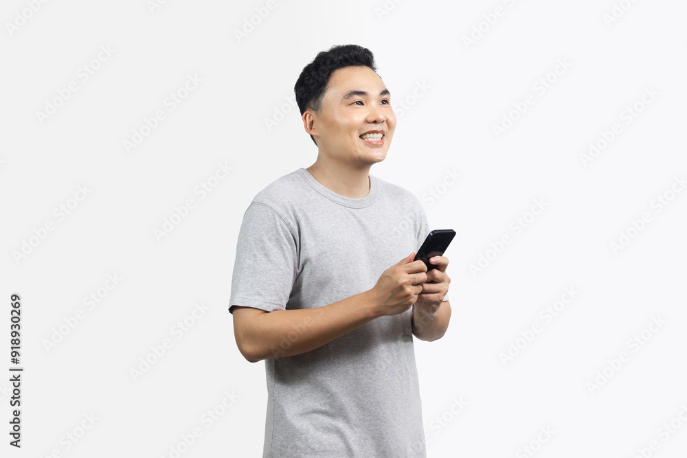 Portrait of smile happy man looking to the side and hold smartphone isolated on white background Portrait of smile happy man looking to the side and hold smartphone isolated on white background