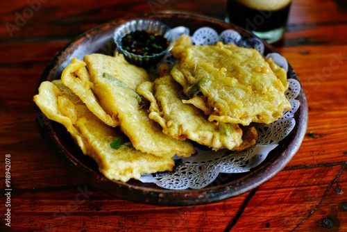 a plate of fried tempe with spicy soy sauce, typical Indonesian food