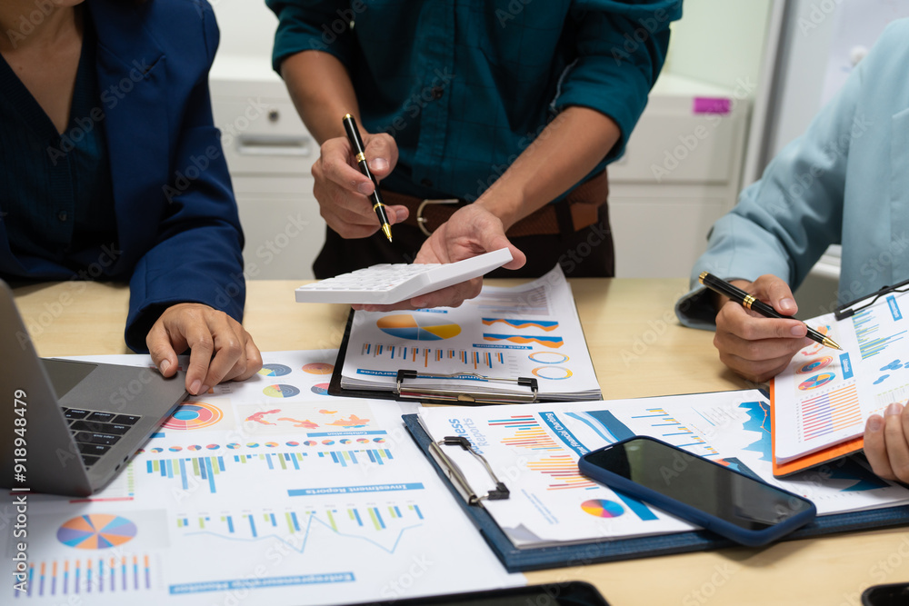 A businessperson, holding hands, cooperate during a corporate meeting. review a graph document together, discussing strategies and financial data to achieve successful outcomes and effective A businessperson, holding hands, cooperate during a corporate meeting. review a graph document together, discussing strategies and financial data to achieve successful outcomes and effective