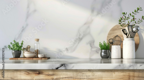 Stylish marble tabletop on wooden platform with copyspace for your logo at blurry kitchen utensils and dishes on light wall background