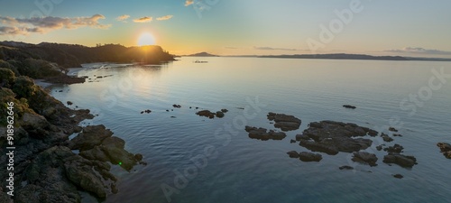 Fototapeta Naklejka Na Ścianę i Meble -  Shoreline of the Firth of Thames at sunset at Orere Point, Auckland, New Zealand.