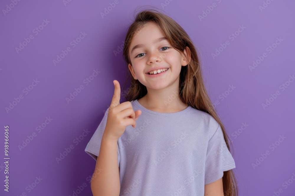 A young child holding a toothbrush, ready to brush teeth A young child holding a toothbrush, ready to brush teeth