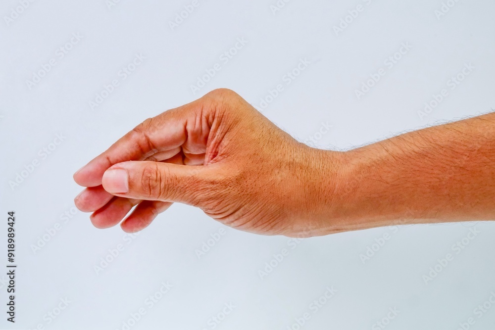 A southeast asian men showing picking something hand gesture isolated on white background A southeast asian men showing picking something hand gesture isolated on white background