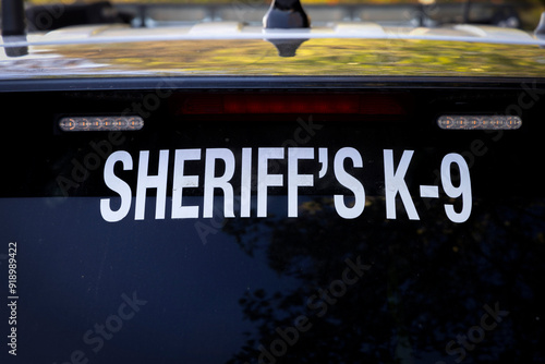 Signs warning that a K-9 dog is in a Sherriff's vehicle photo