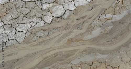 Muddy Vulcanos located in Buzau County, Romania, a National Landmark, Gas bubbles coming out a mud volcano. Paclele mici and Paclele Mari photo