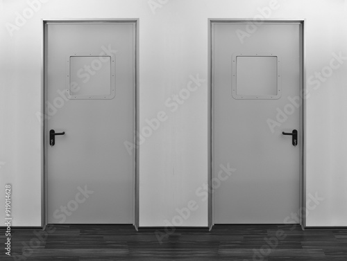 Emergency exit two grey door. Push bar and rail for panic exit