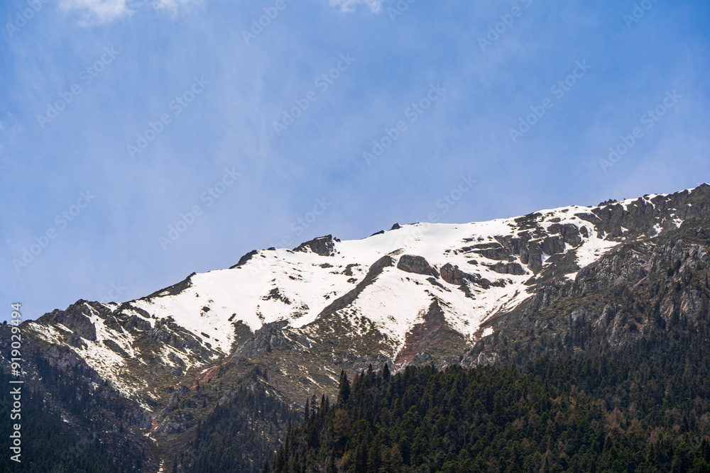 Fototapeta premium Snowy mountain peak in Jiuzhaigou National Park, China