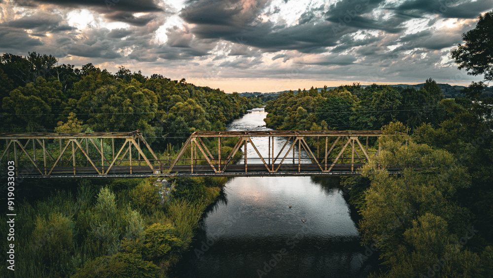 Fototapeta premium A old train bridge on a river