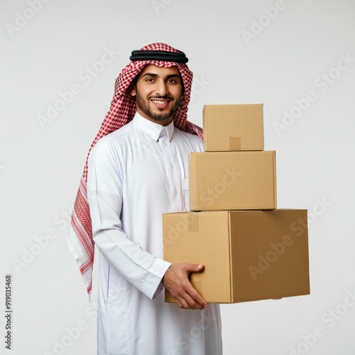 Saudi man holding takeaway bag isolated on white background
 photo